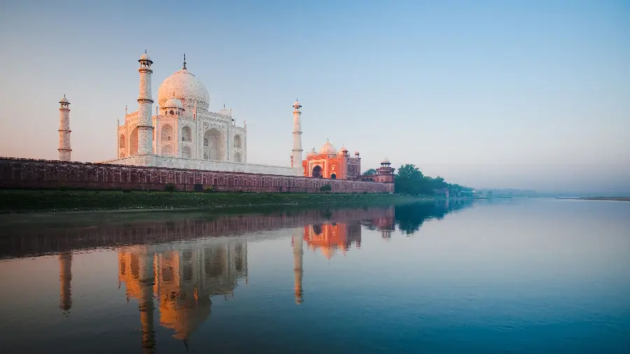 Very high-quality image of the Taj Mahal in India next to the blue lake