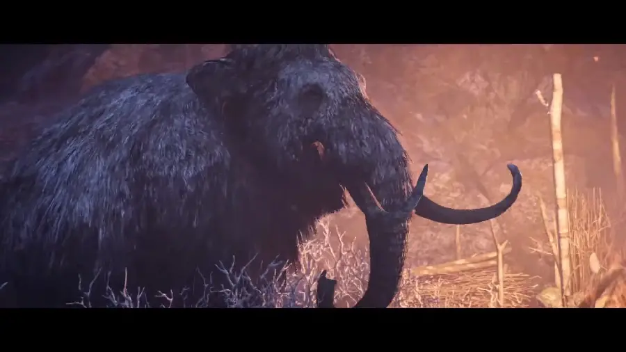 A blurry and awkward photo of a burnt, frightened mammoth in a fire