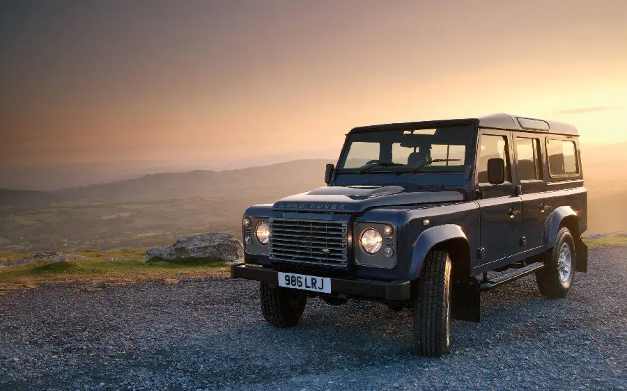 Photo of old and black model of Land Rover Defender