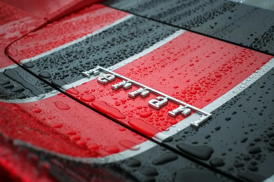 Image of the logo engraved on a Ferrari car in Full HD quality for Telegram profiles