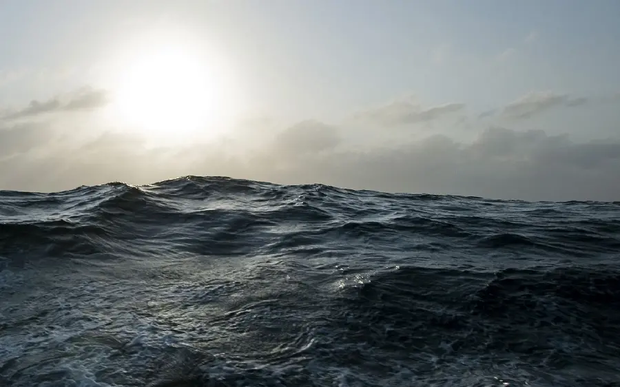 Download Ocean Waves Background Under the Attractive Sunlight with a Blurred Theme in Full HD Quality