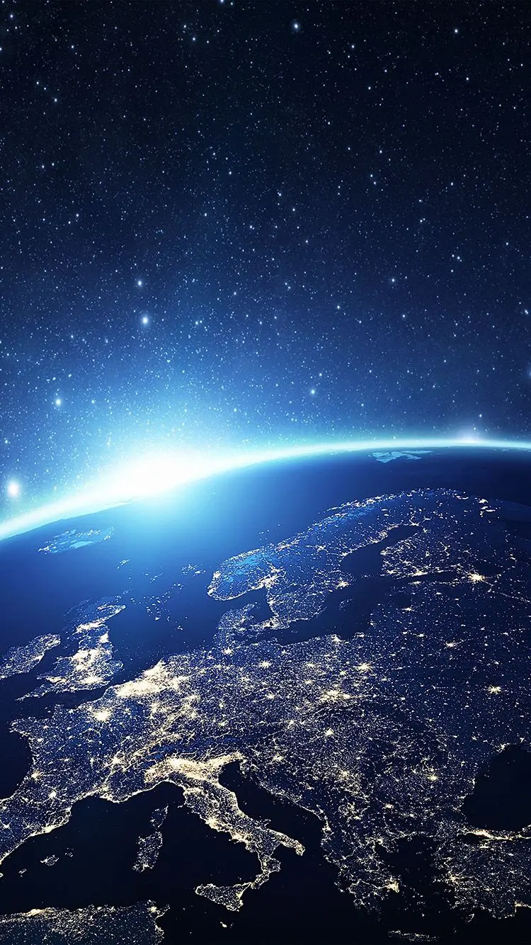 Download spectacular wallpaper of the Earth at night with a beautiful blue halo for Windows 11