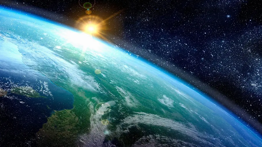 Wallpaper of the sunrise on Earth in space