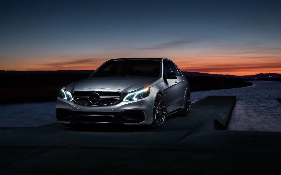 Photo of proud and attractive Mercedes AMG E63 in the dark of the night