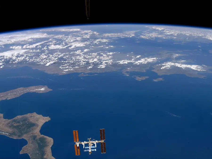 Real laptop photo background of the planet and its blue expanses from NASA