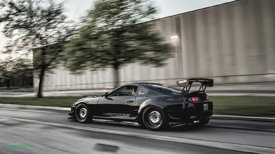 Download the most famous and popular black Toyota Supra photo on the road