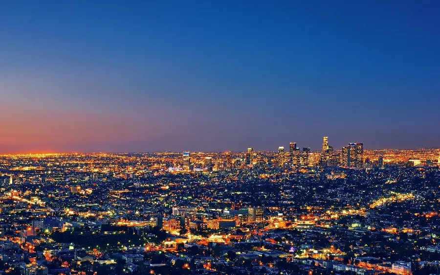 Background photo of Los Angeles city with famous towers in the center and blue sky