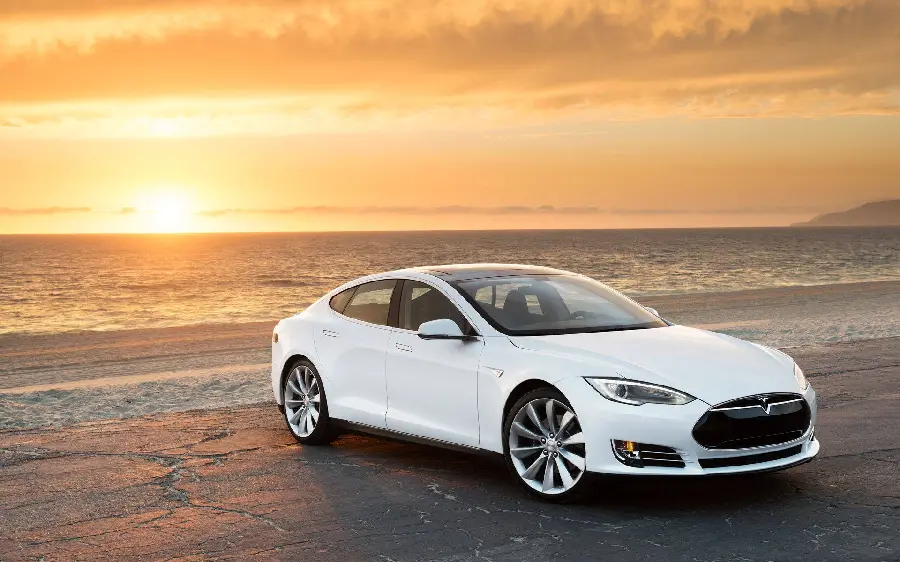 Wallpaper of a beautiful Tesla on the beach