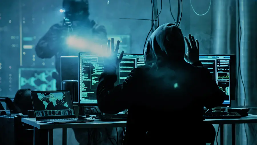 Photo of the moment a hacker surrenders to the law and is arrested