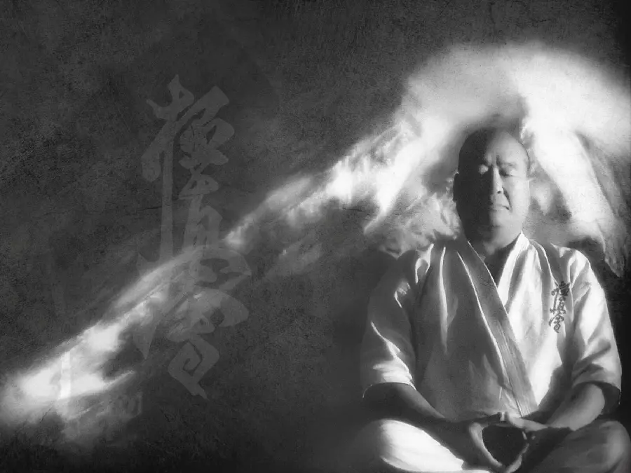 Photo of a karateka and a master practicing mentally to master karate