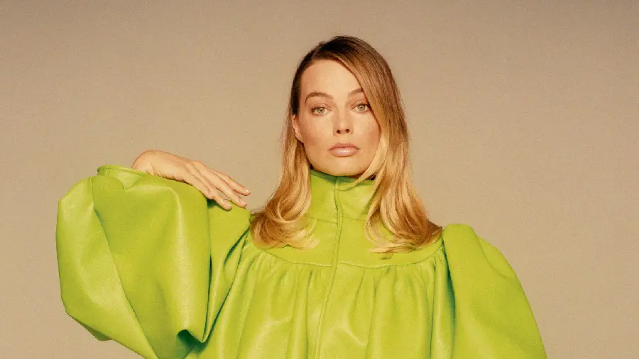 Margot Robbie's photo with a mustard-colored hairstyle and dress