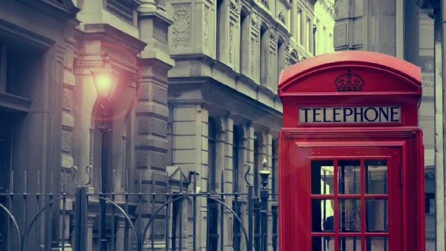 Photo of a telephone booth located on a famous street in London
