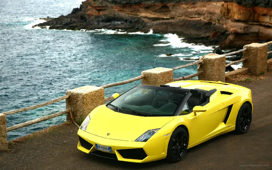 Full HD quality background of yellow Lamborghini Murciélago by the sea for Windows 11