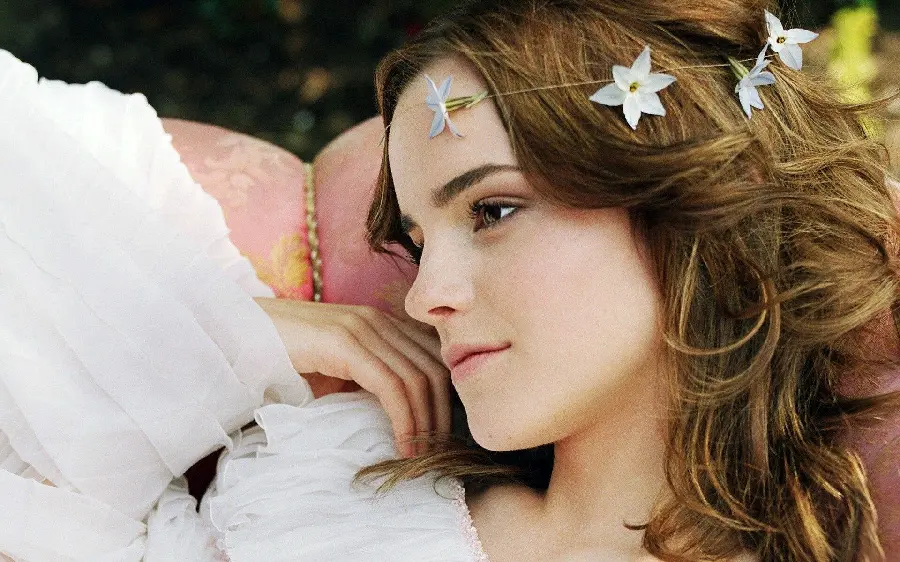 Emma Watson photo with white wedding dress and flowers on the forehead