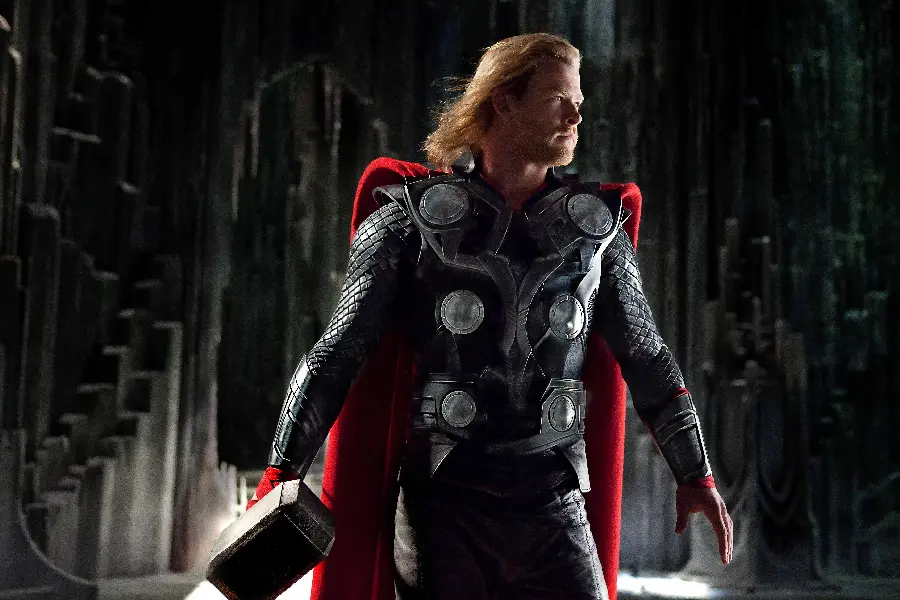 Background photo of the superhero character Thor with a red cape and attractive long hair