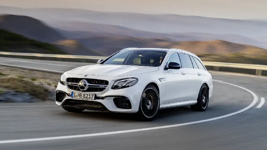White Mercedes-Benz AMG E63 Wallpaper in the Middle of the Road