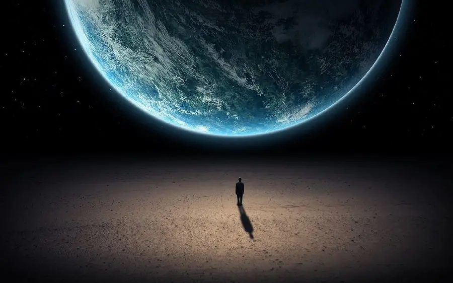 Interesting Photo of a Person Standing in Front of the Earth at Night Suitable for Profile