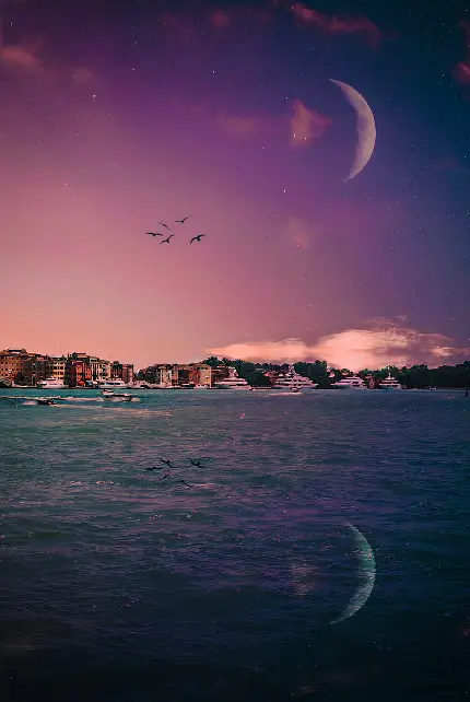 Moon background with pink clouds in clean blue sky