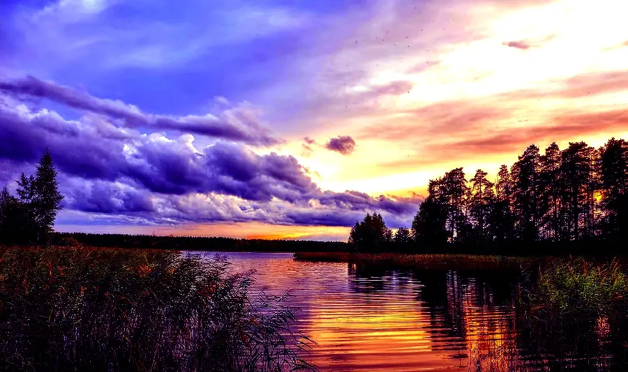 Download a lovely sunset landscape photo with a purple and orange color theme 