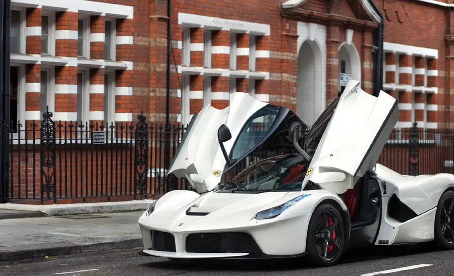 The latest picture of a sporty pearl white Ferrari with special technology used in its doors