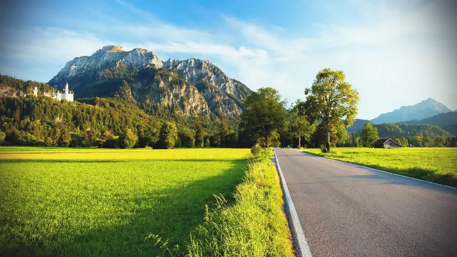 Interesting view of the road in the heart of lush nature for laptop and computer backgrounds 