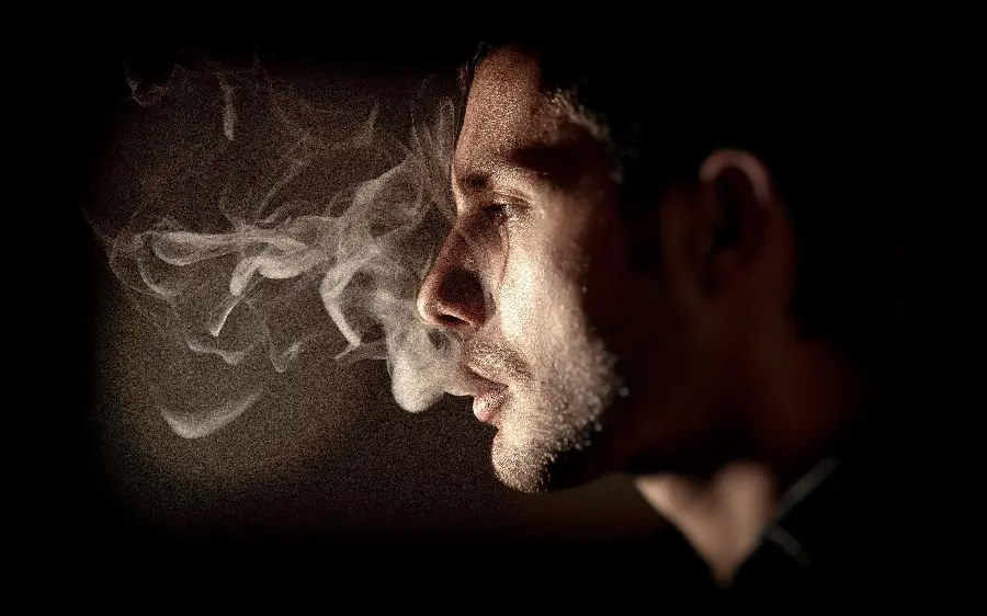 Attractive background photo of a smoking man with special quality 8k