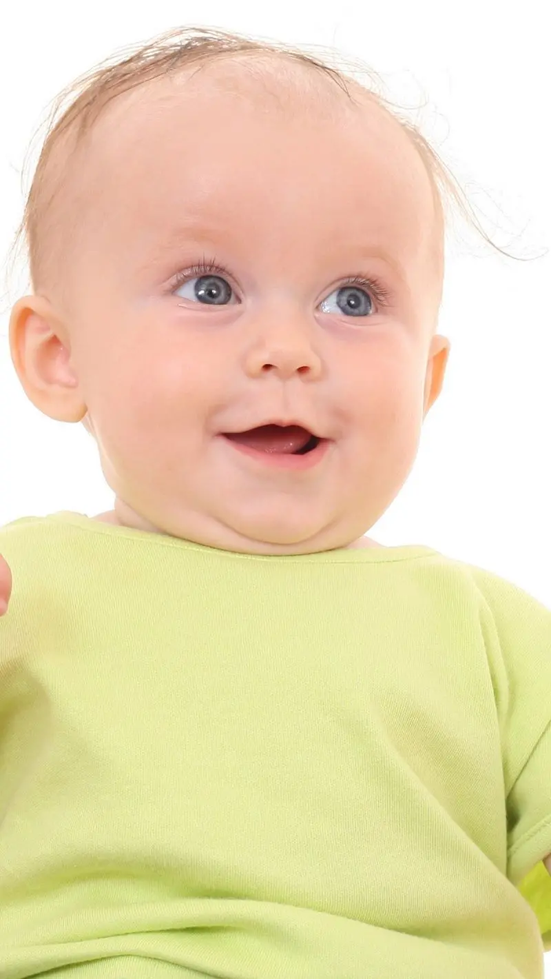 Phone background with a picture of a cute foreign child in a green dress 2022