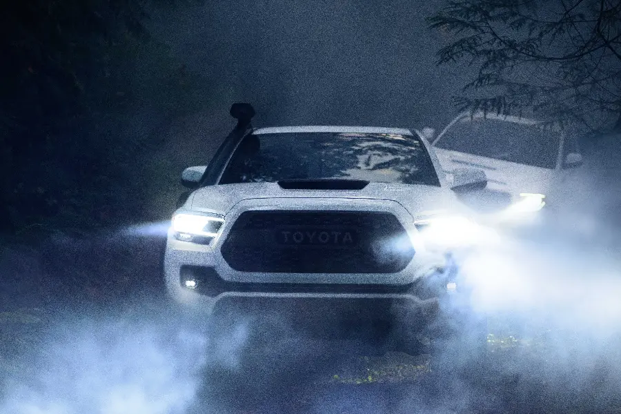 Cute background of a full-option Toyota Tacoma in thick fog