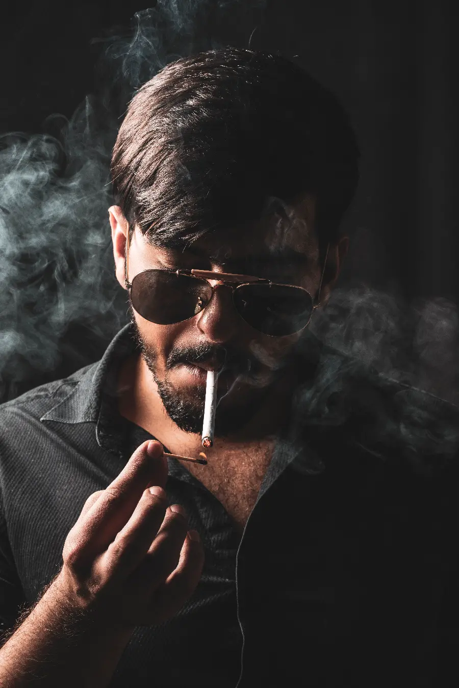 Free download of a profile photo of a cool and stylish boy smoking in HD quality