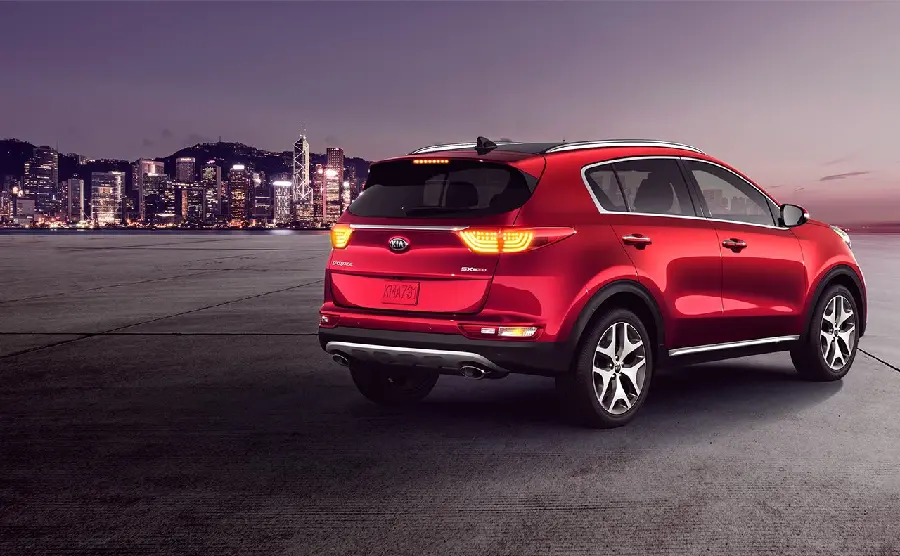 Attractive image of the red Kia Sportage car from the back angle