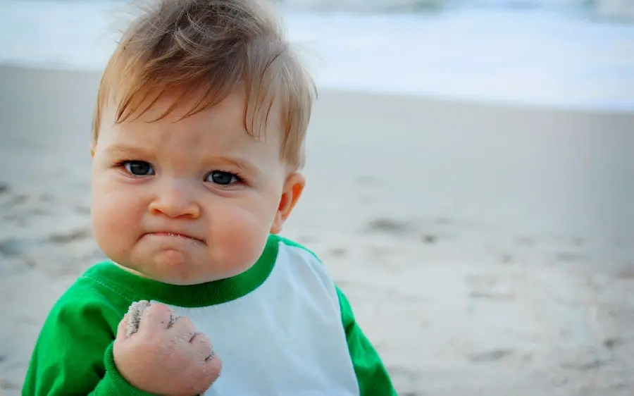 Famous image of a boy with a motivational face and a fist