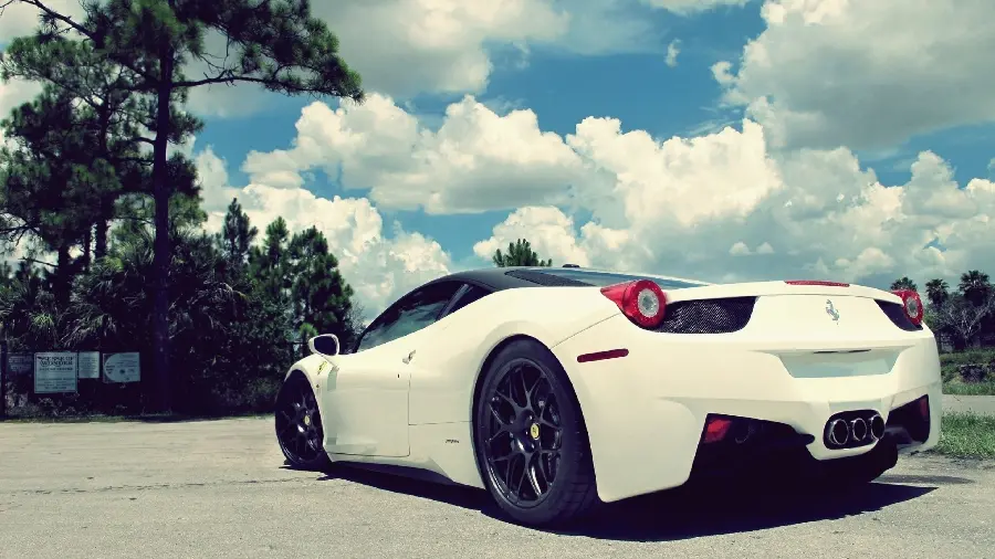 Fantasy image of a magnificent white Ferrari with a blue sky with big clouds