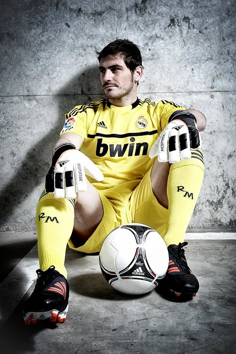 Attractive wallpaper of Casillas in a yellow dress and sitting on the floor