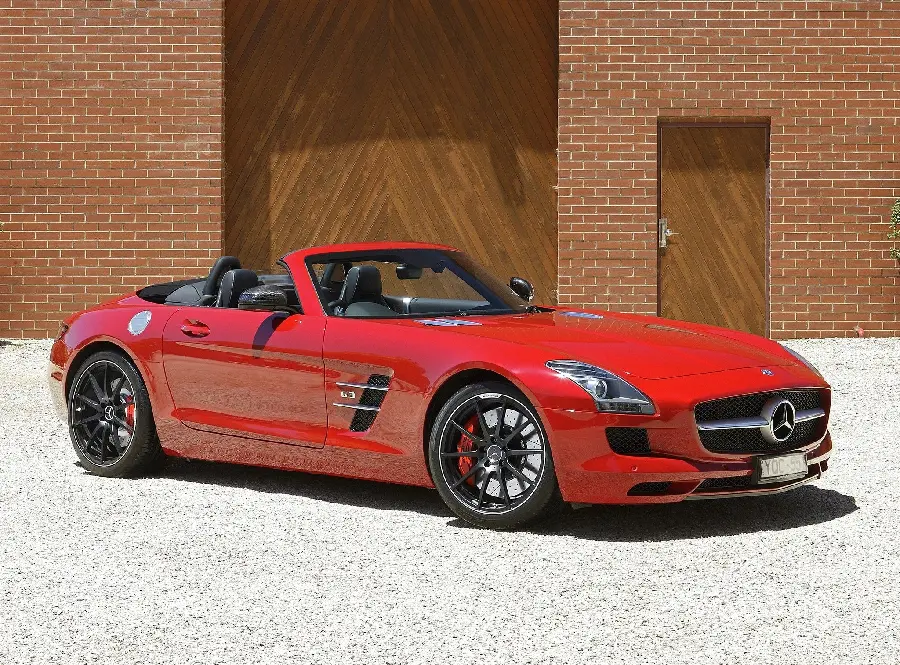 Awesome profile photo of red Mercedes-Benz in the sunlight next to brown doors