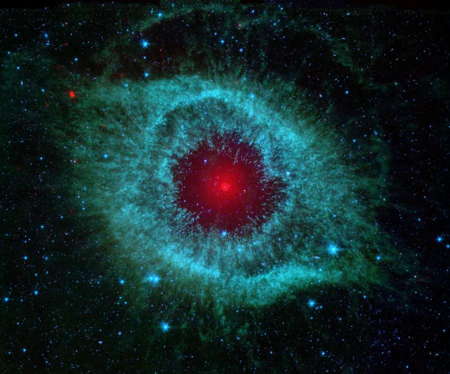 A delightful stock photo of the Eye of God nebula with a red and Green-blue
