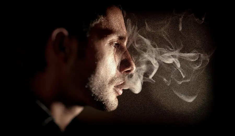 Artistic image Smoking man with attractive face from profile for profile 