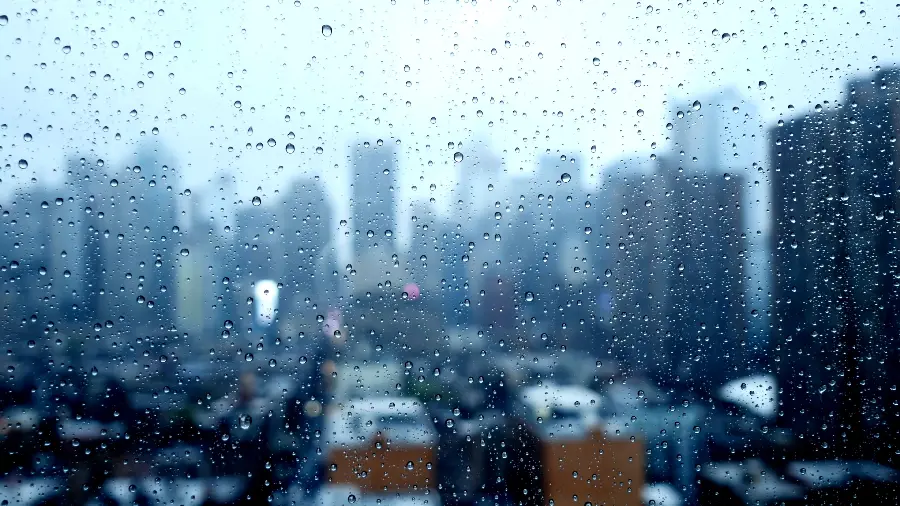 Sad and rainy city view with a cloudy and blue theme in HD quality 