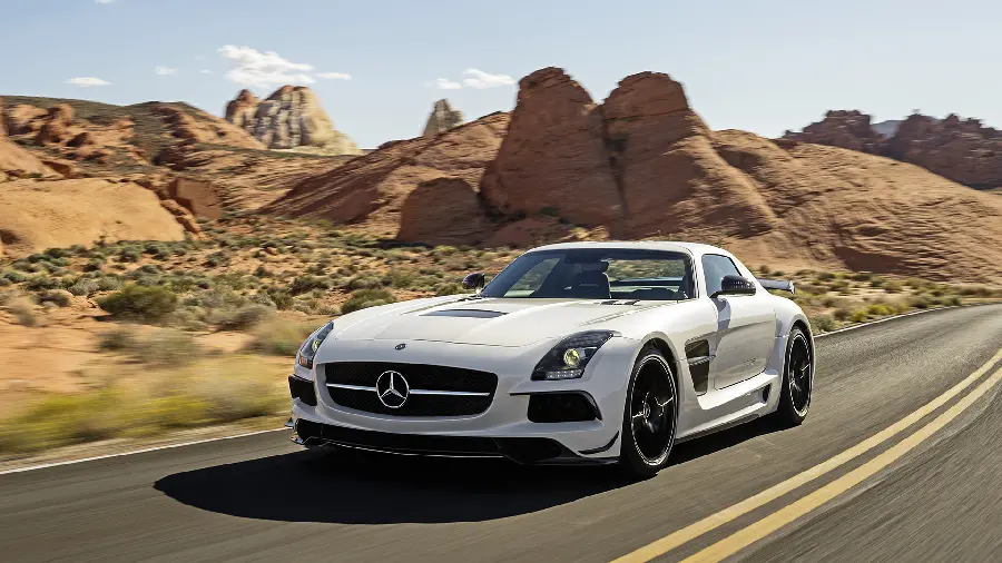 Fantasy image of white Mercedes-Benz moving next to weak vegetation