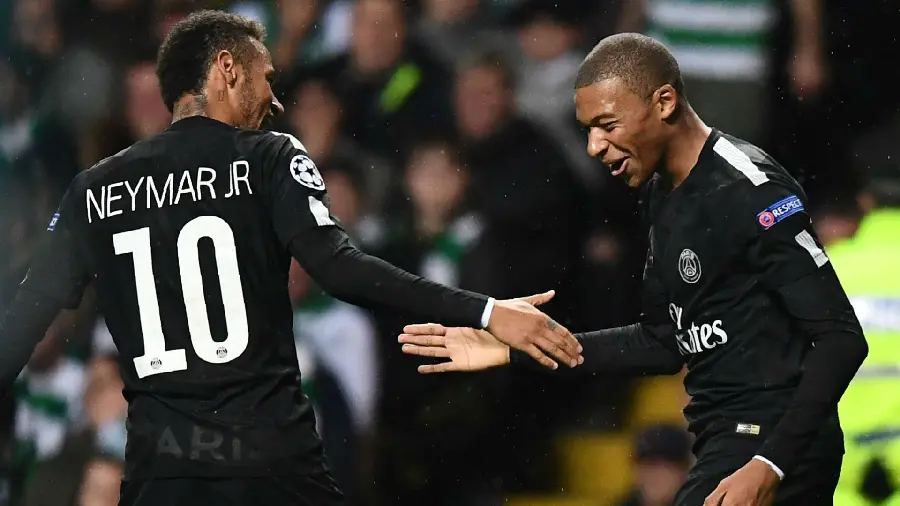 Unique stock image of Neymar and Mbappe shaking hands together in black sportswear