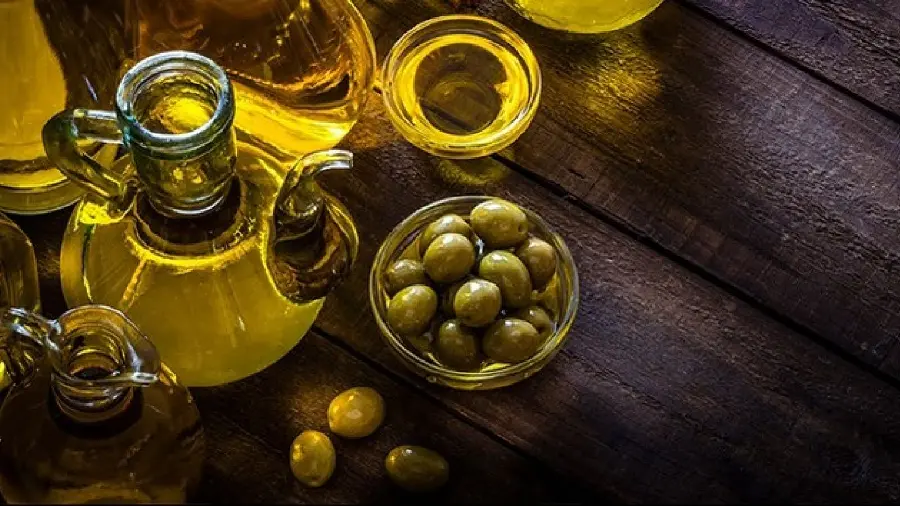 The most mysterious olive oil advertising photo with a yellow theme and Wooden