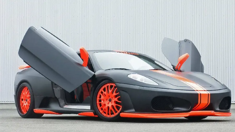 Wallpaper of a black and red Ferrari car with open doors