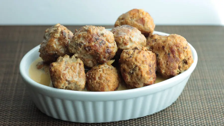 Very high-quality background photo of an unusual food dumplings in a round white bowl