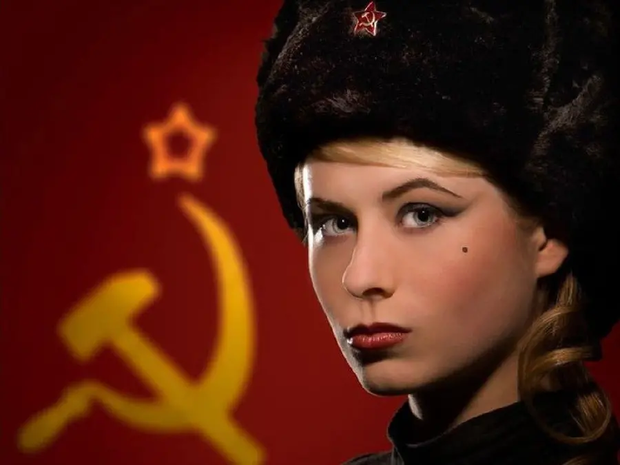 Popular stock photo of a Russian girl in a black hat with colored eyes and beautiful hair on a patterned background