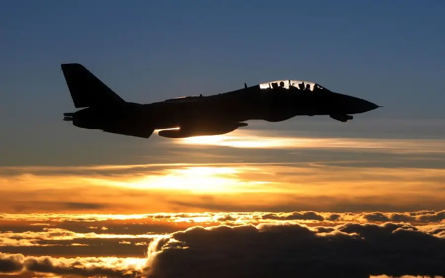 The most beautiful stock photo of a warplane flying in the sunset sky