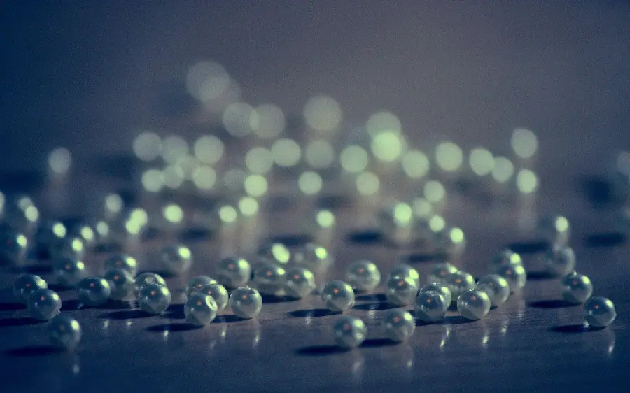 Background image of small pearls in a seashell on a web page