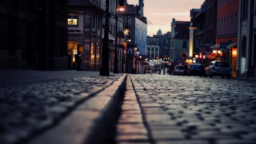 Download a new background of bright lights on an urban road from a short distance