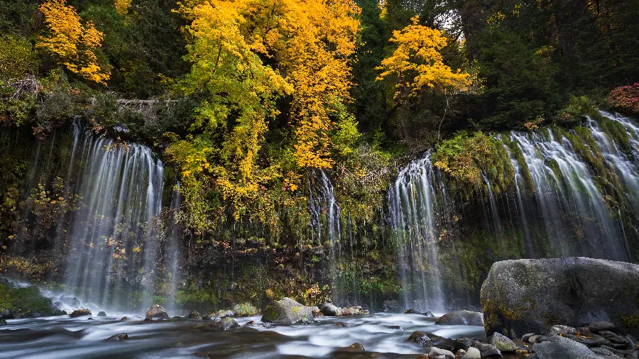 Wallpaper of heartwarming waterfalls in autumn in a beautiful artistic frame with 8K quality
