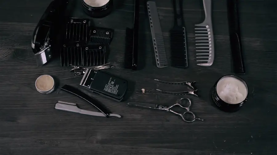 Download a picture of a barber's tool with a black background for your profile 