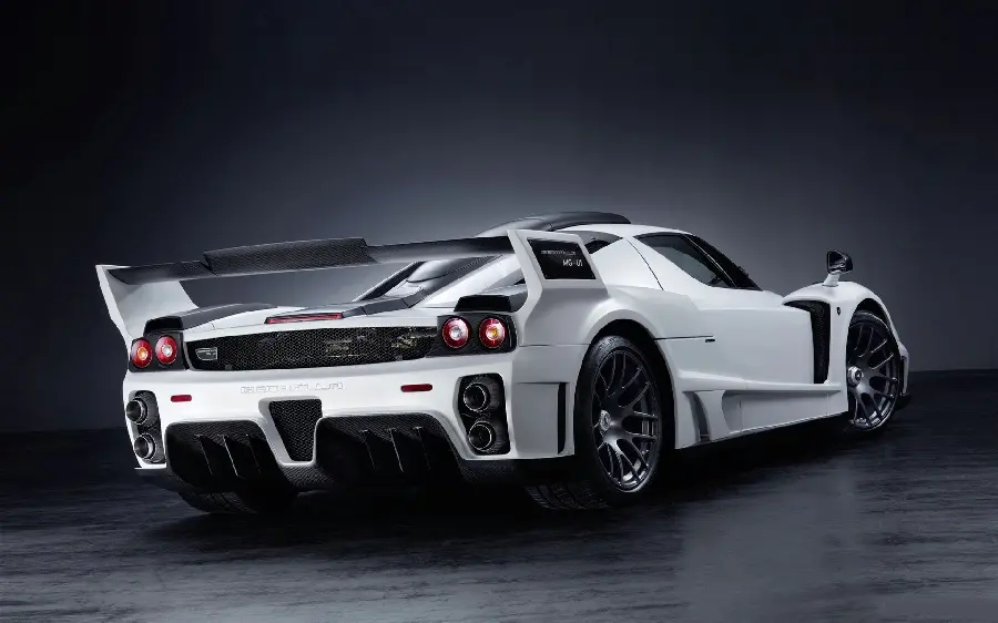 Fantasy image with a dark and black background of the trunk of a Ferrari Enzo