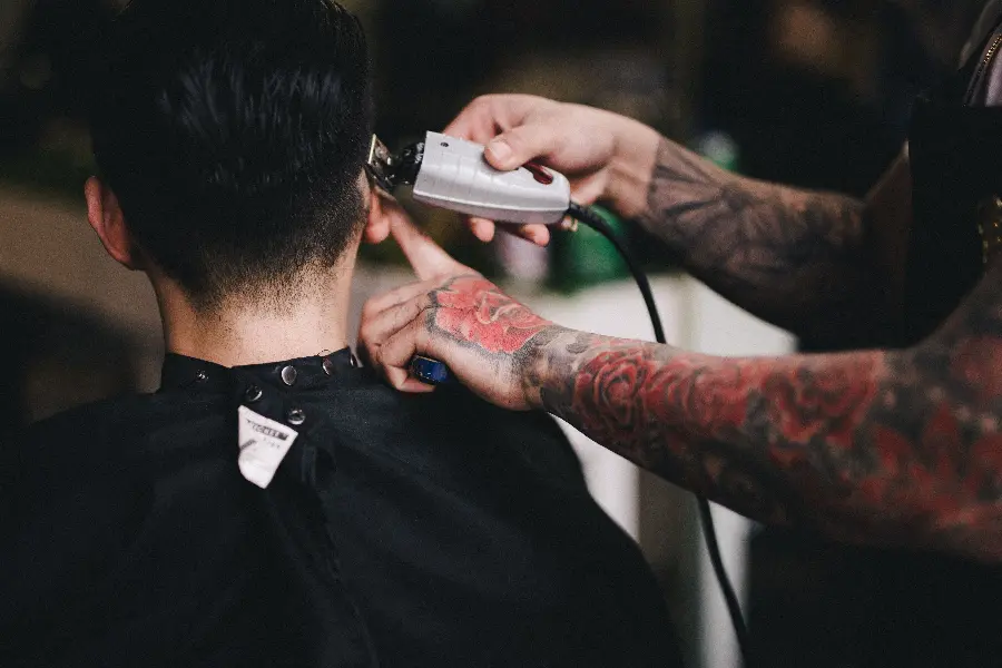 Download a very high-quality picture of a male barber for your profile 
